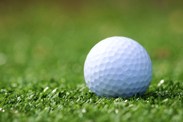 Golf ball on green grass
