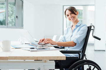 Smiling business woman in wheelchair