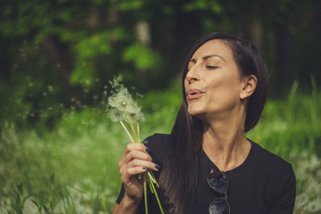 The beautiful woman with Dandelion