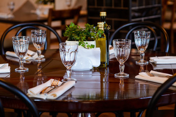 Tableware on wooden table in restaurant