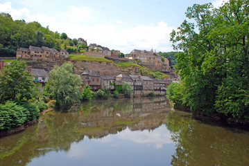 Fototapeta na wymiar Charming village located on the river side in Rhone Alpes region