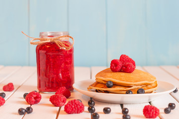 Stack of wheat golden pancakes or pancake cake with freshly