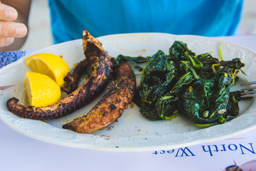 The lunch with octopus and spinach
