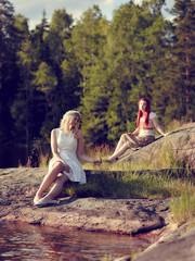 Attractive women on the lake