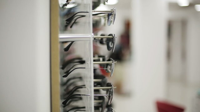 Glasses shown on a wall at the optical shop