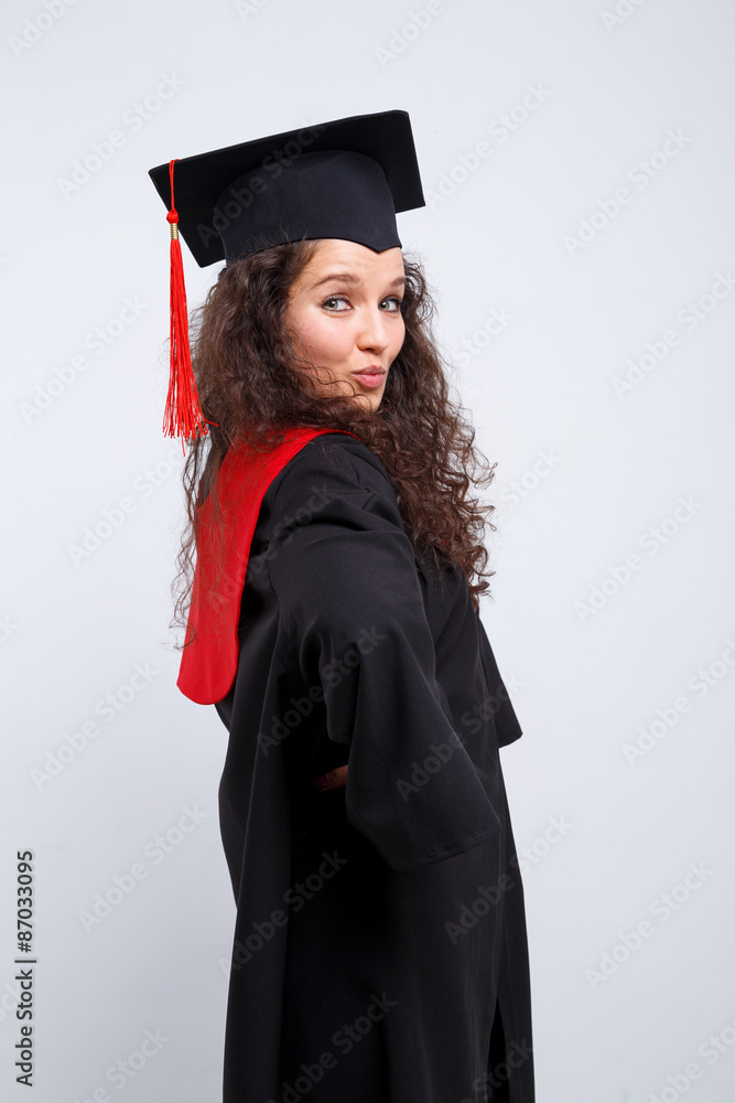 Wall mural Studio portrait picture from a young graduation woman - Wall murals