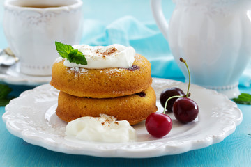 Clafoutis with cherries and whipped cream.