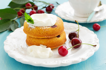 Clafoutis with cherries and whipped cream.