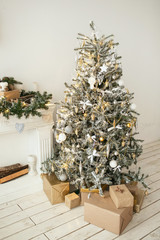 Beautiful holiday decorated room with Christmas tree with presen