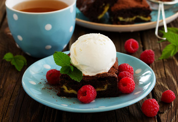 Brownie with raspberries and cheese filling.