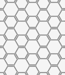 Perforated paper with hexagons forming bee grid