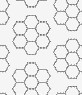 Perforated paper with hexagons forming flowers