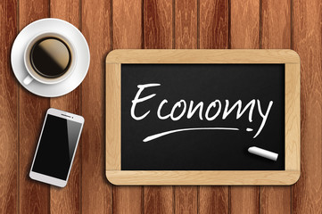 coffee, phone  and chalkboard with  word economy