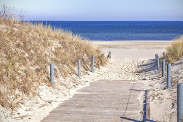 Wooden sandy path to the beach.