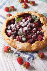 Summer pie with raspberries and mint close-up vertical

