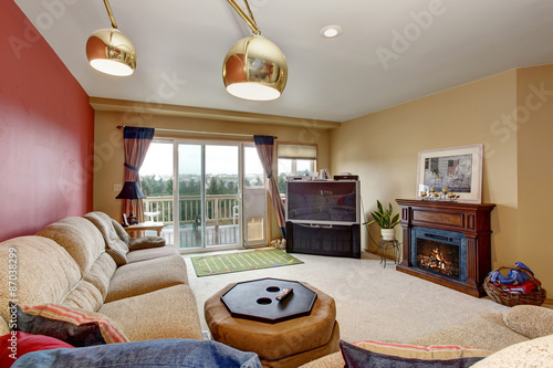 Modernized Living Room With One Red Wall And Fireplace Stock Modernized Living Room With One Red Wall And Fireplace