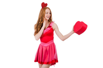 Pretty young model in mini pink dress holding gift box isolated
