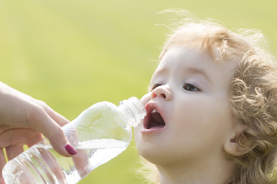 Child Drinking Water From Bottle