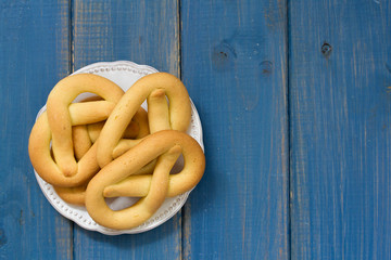 cookies in plate on blue wooden background