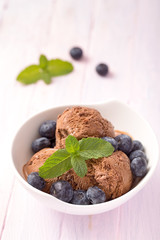 Chocolate ice cream with blueberries closeup