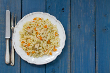 rice with meat and carrot on white plate