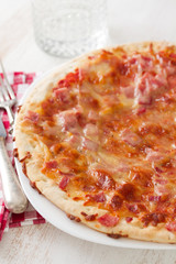 pizza on white wooden background