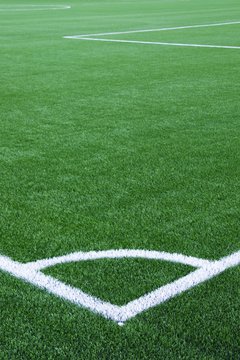 White line  corner on green football field