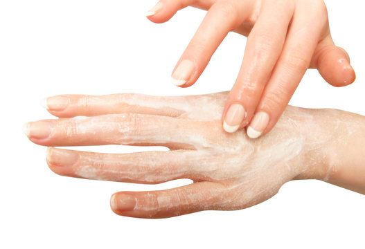 Female hand smeared with cream