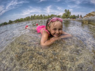 Little girl playing on the beach