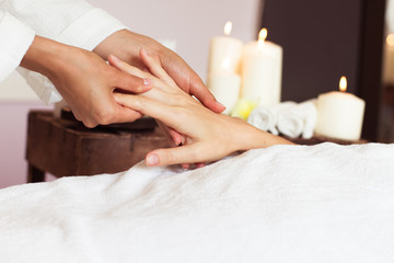 Fototapeta na wymiar Woman receiving a hand massage at the health spa