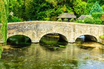 Fototapeta na wymiar Old bridge over river Coln in village Bibury England