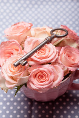 Old key and roses