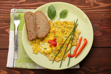 egg omelette with paprika and green herbs and bread
