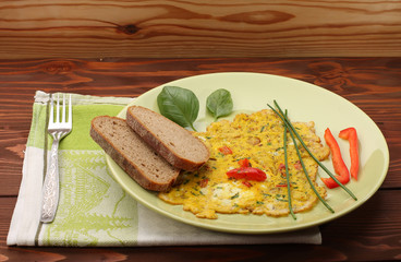 egg omelette with paprika and green herbs and bread