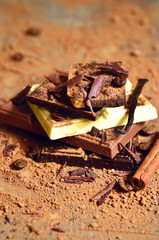 Stack of chocolate slices with cacao powder.