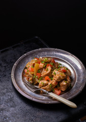 Chicken stew with onion, pepper ant tomato
