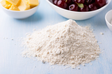 Heap of wheat flour on table