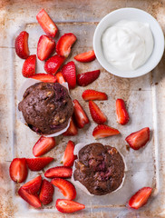 Chocolate muffins with nuts and cherry