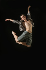 young ballet dancer dansing on white background