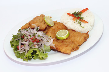 Peruvian Dish: Fried Fish with salad, lemon and rice.