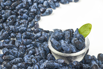 Honeysuckle berry fruits in a glass bowl