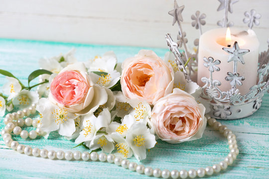 Sweet pastel  roses, jasmine flowers  and candle