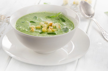 Creamy soup with croutons .