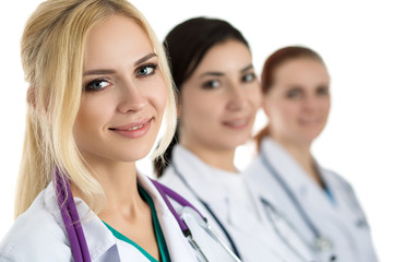 Portrait of young blonde female doctor surrounded by medical tea