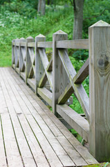 Railing and fence of wooden bridge in the park