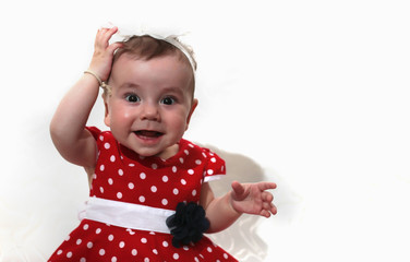 little girl in a red dress and beads