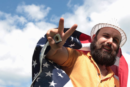 man with a beard with American flag