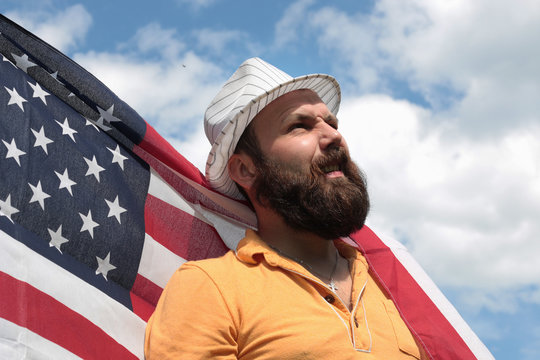 man with a beard with American flag