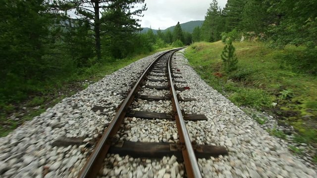 Narrow gauge railway  - camera flying over rails, steadicam shot