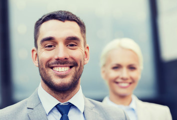 close up of smiling businessmen